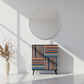Colorful striped cabinet in minimalist entryway