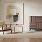 Colorful striped cabinet in upscale living room