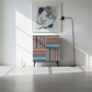 Professionally staged colorful striped cabinet in modern luxury setting